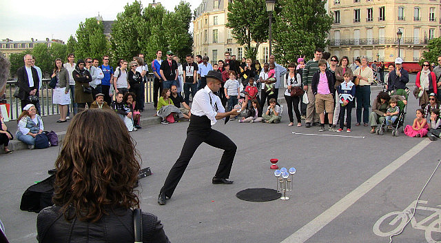 Street performer on the Seine River
